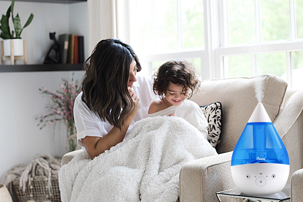 Crane Drop 2.0 EE-5306 in Blue & White shown on a side table in a home scene.