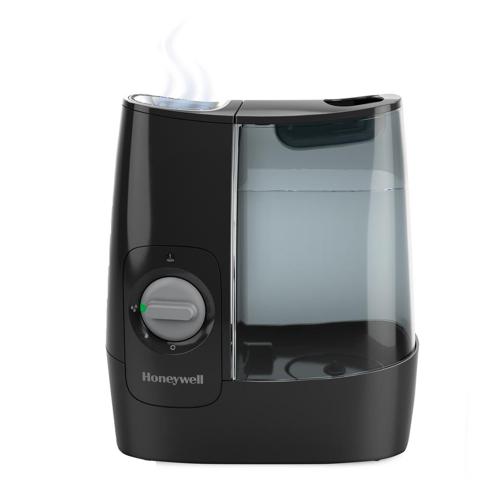 Black Honeywell HWM845B warm-mist humidifier with translucent tank, chimney and rotary high-low control