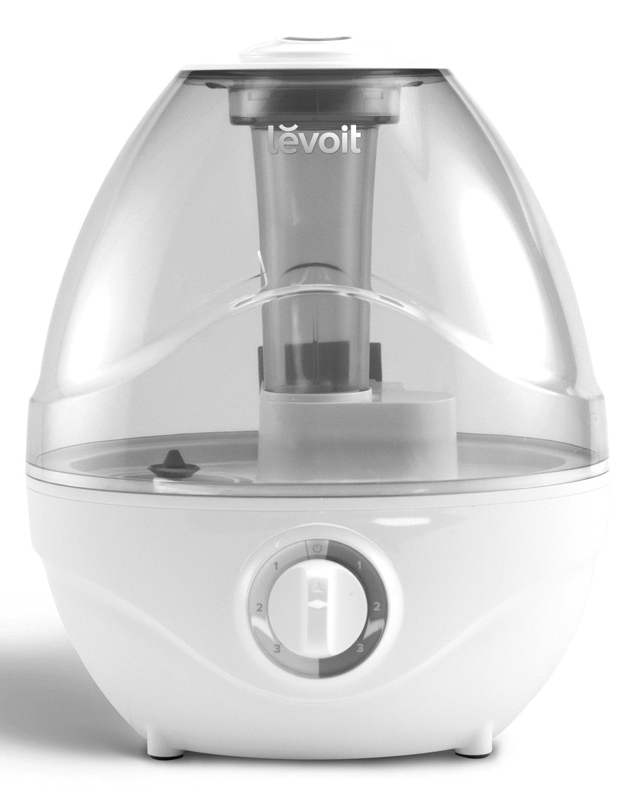 White Levoit Classic 100 ultrasonic humidifier with a clear tank, mist nozzle and rotary control dial