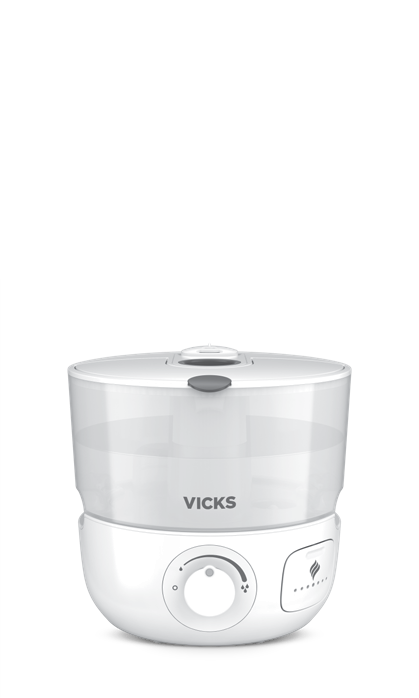 Vicks VUL585 Series top-fill humidifier illustration with a translucent tank, front output dial and side scent-pad door.